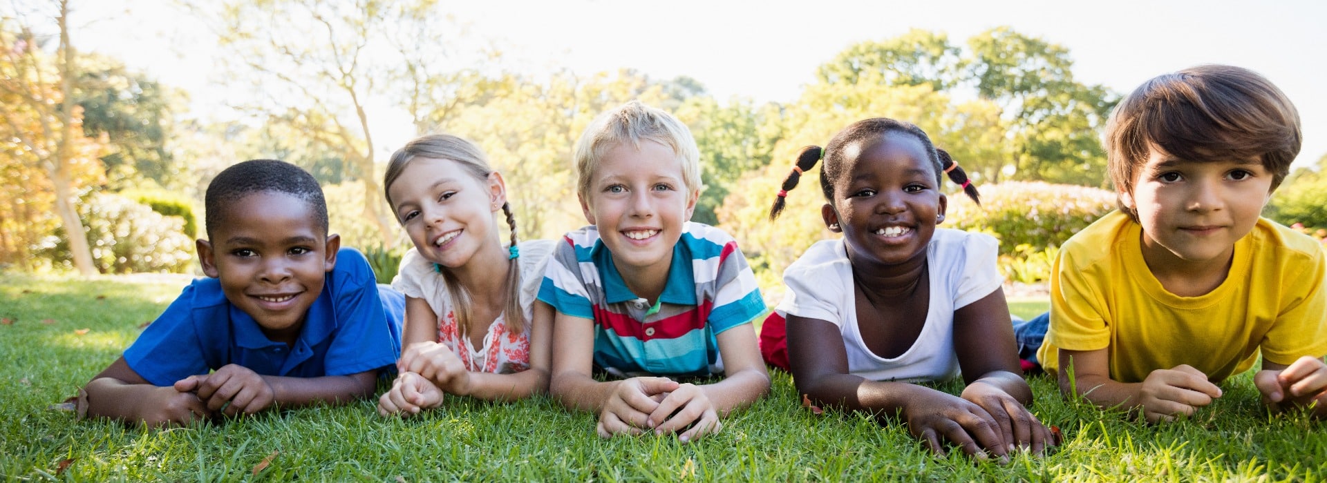 Kids posing together during a sunny day at camera